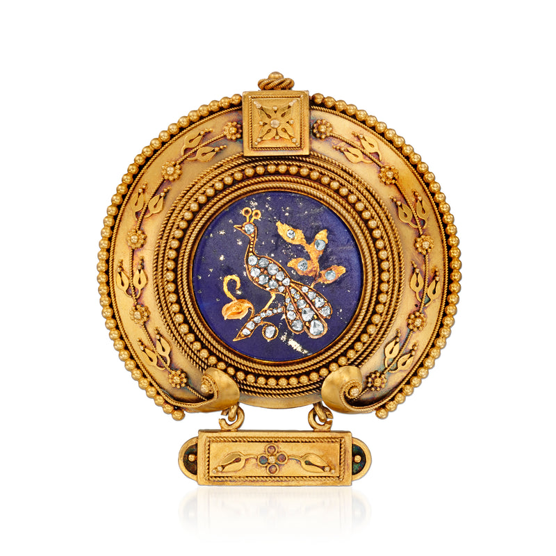 Vintage gold-tone peacock pin with blue lapis-style oval and small diamond accents