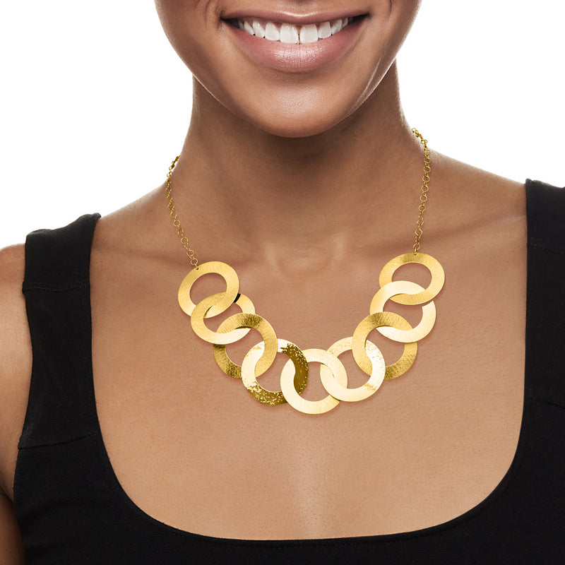 Gold over sterling circle-link necklace with chunky interlocking loops on collarbone