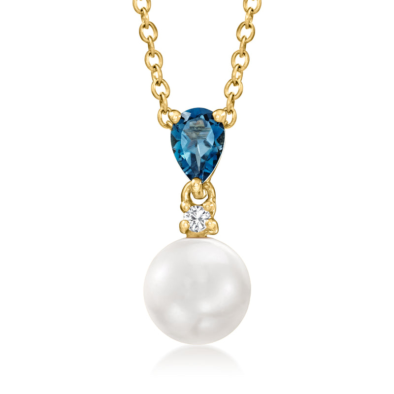 Gold-tone pendant necklace with blue teardrop stone, white pearl, and zircon accents