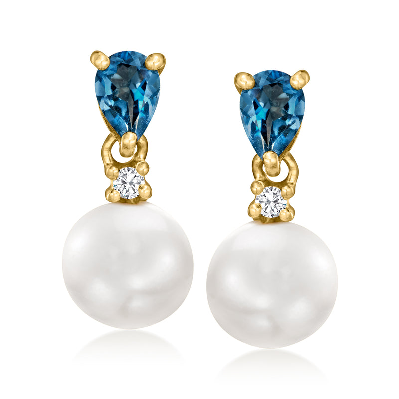 Pair of gold-tone drop earrings with blue stones, white pearls, and clear zircon accents