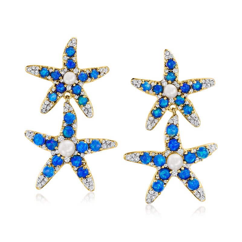 Gold-tone drop earrings with blue gem starfish and white pearl centers