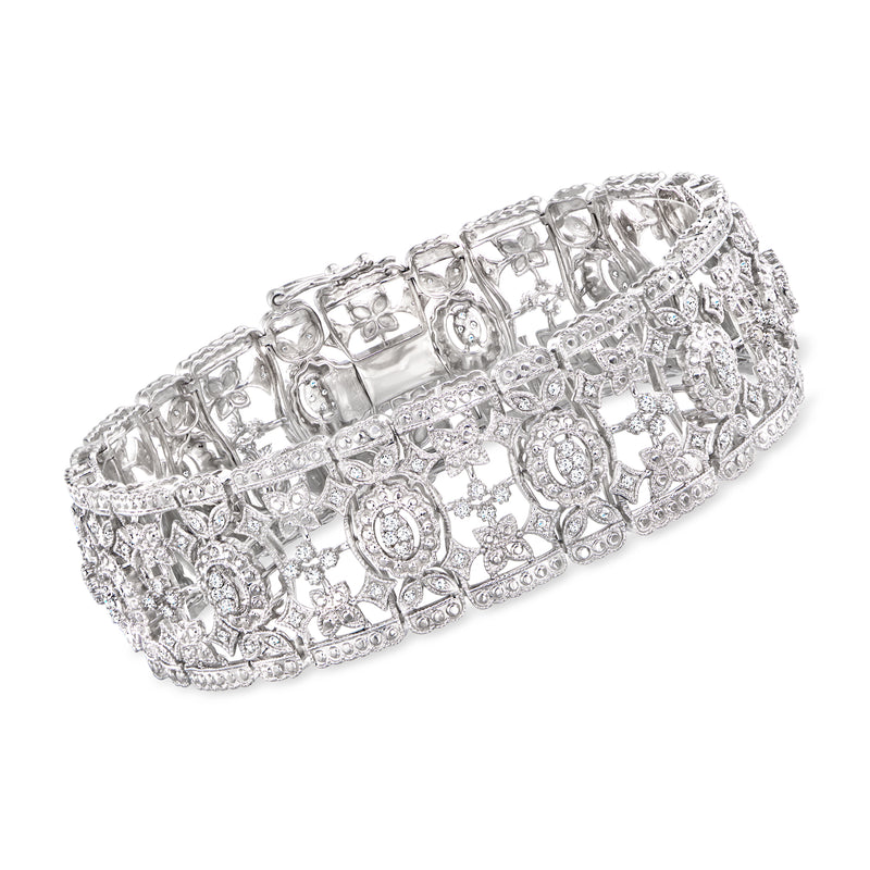 Vintage-style sterling silver bracelet with oval and round stones, ornate hinged design
