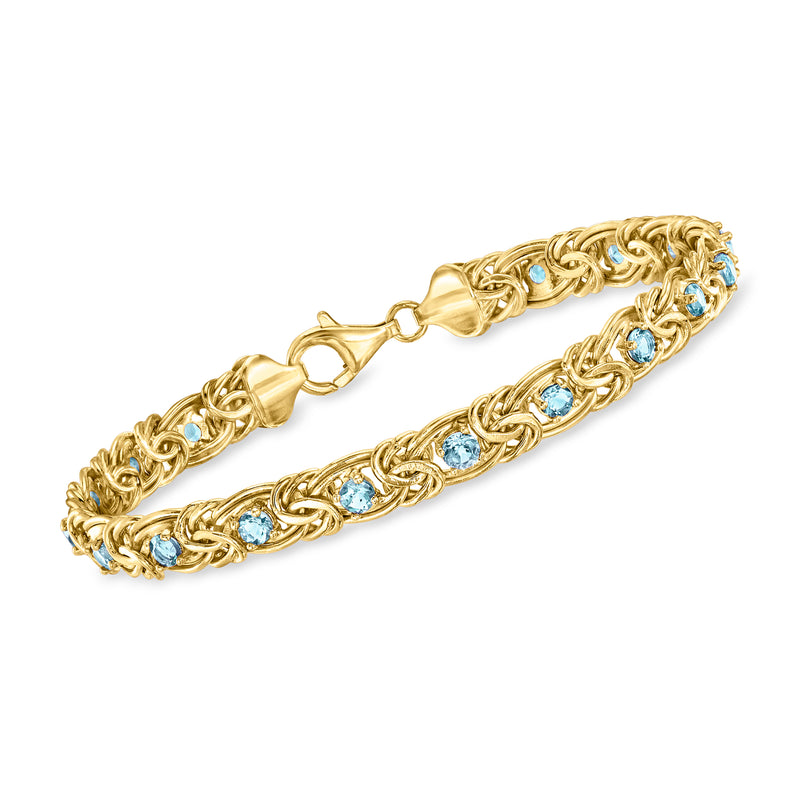 Gold Byzantine bracelet with oval blue gemstone links and clasp, bezel-set topaz style