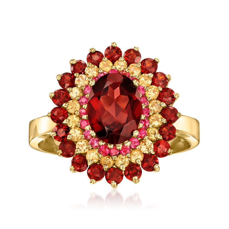 14kt yellow gold ring with oval red center gemstone and halo of red and light stones