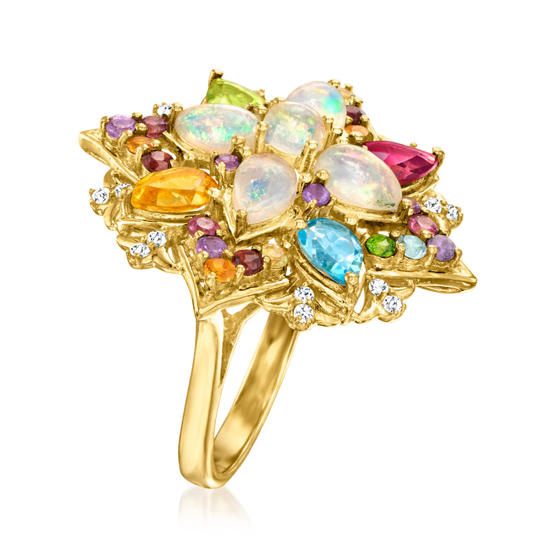 Gold tone multi-gemstone ring with opal-like stones, diamond accents, and openwork setting
