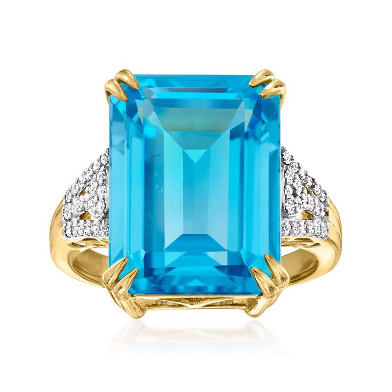18kt yellow gold ring with large blue topaz center and diamond side accents