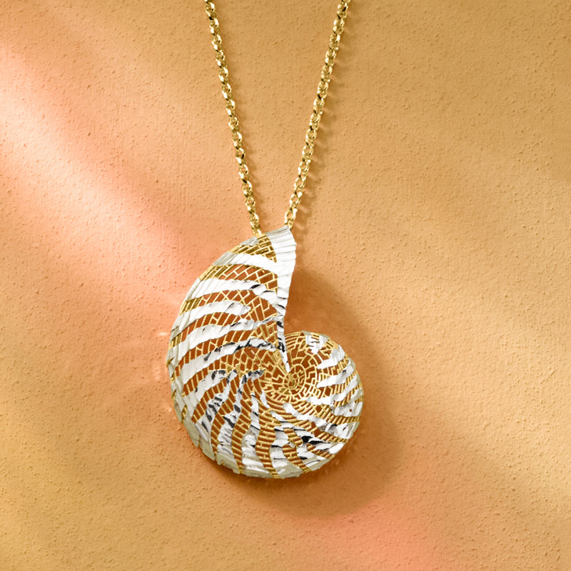 Seashell pendant necklace with textured swirl ridges in gold and silver tones