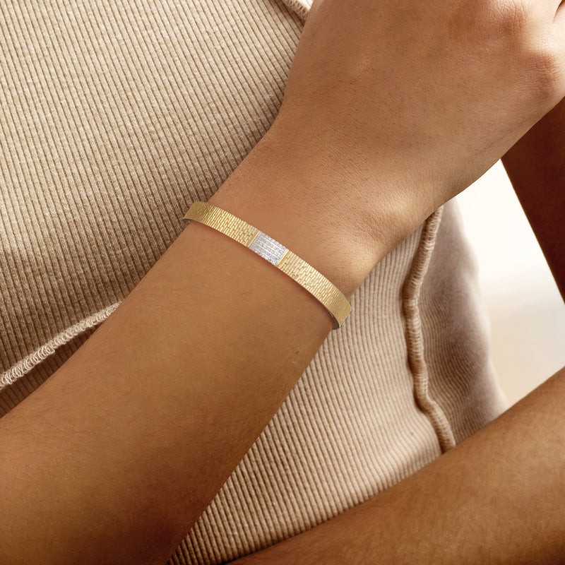 Diamond cuff bracelet in 18kt gold over sterling with pavé center accent