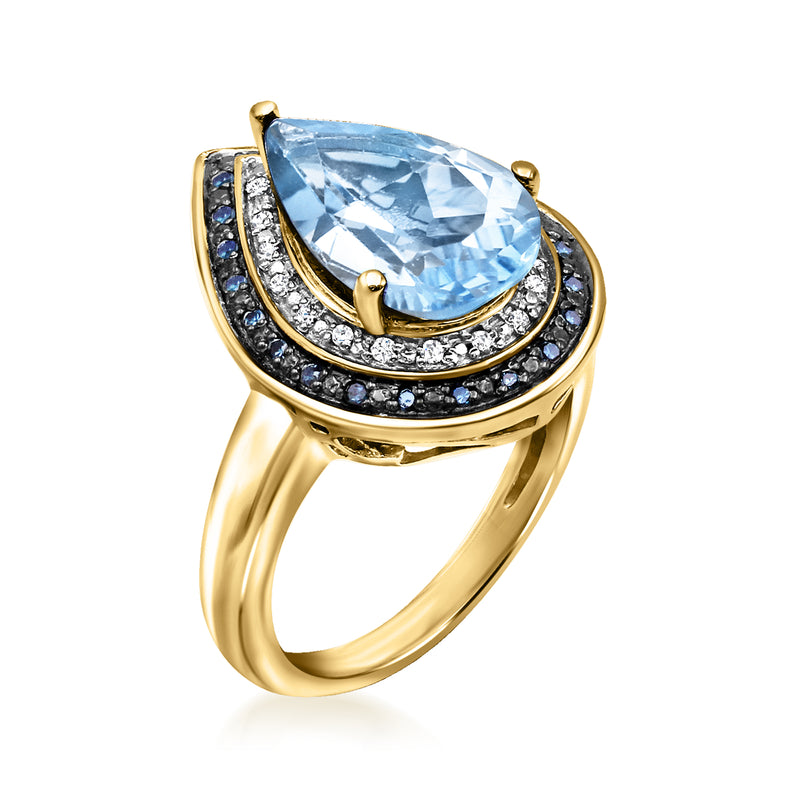 Pear-cut sky blue topaz ring with blue and white diamond halos in gold over sterling