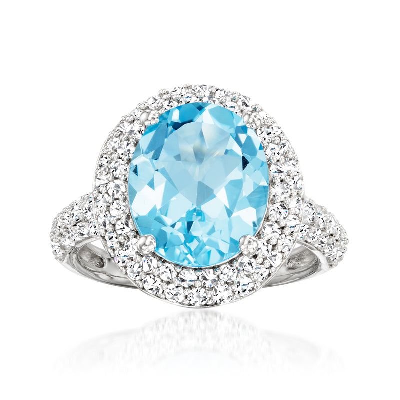 Sterling silver ring with oval Swiss blue topaz center and white topaz halo