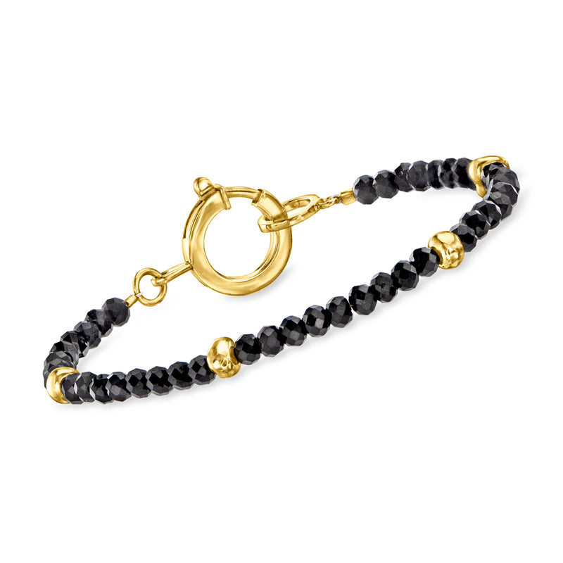 Onyx bead bracelet with gold hoop clasp and black faceted beads