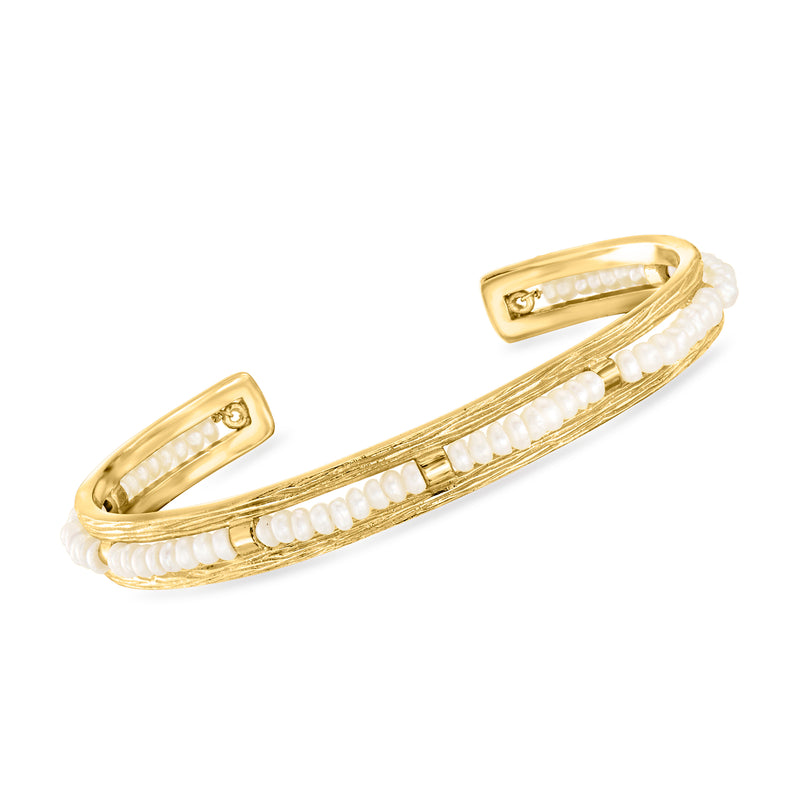Gold cuff bracelet with cultured pearl rows and small bezel accents
