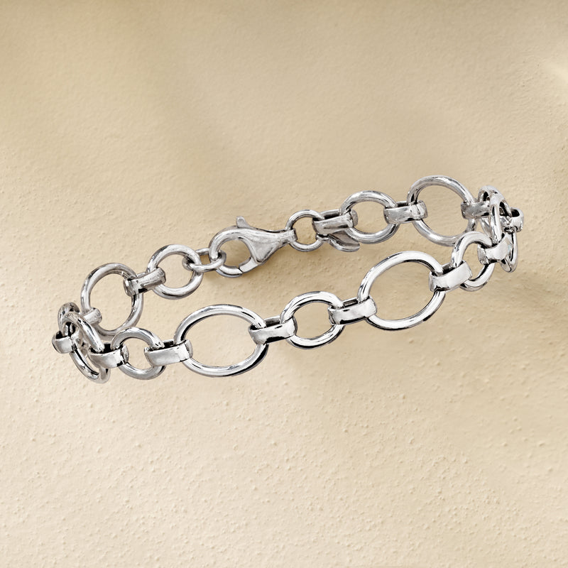Sterling silver cable and oval-link bracelet shown from the side, spring ring closure