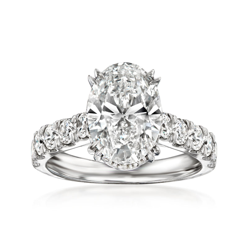 14kt white gold diamond ring with oval center and round side stones
