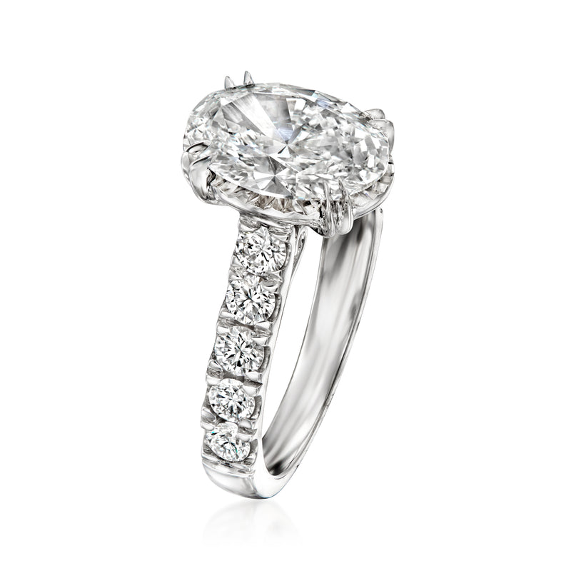 14kt white gold diamond ring with oval center and round side stones, side view