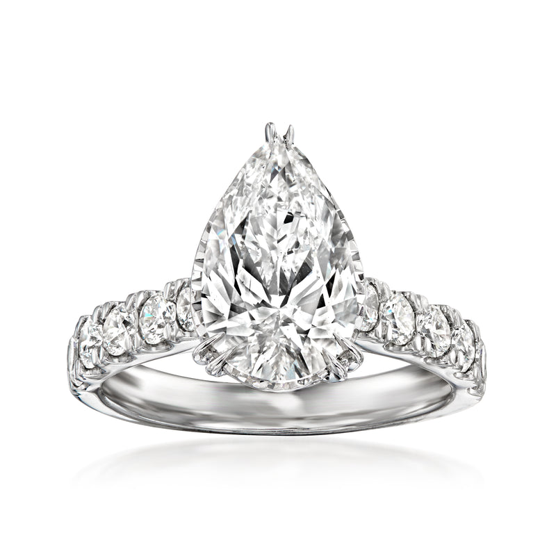 White gold pear-shaped diamond ring with round side stones, prong-set center stone