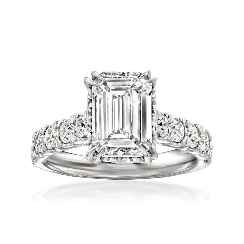 14kt white gold diamond ring with emerald-cut center and side stones