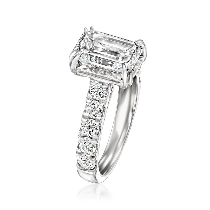 Emerald-cut diamond ring with side stones, 14kt white gold band
