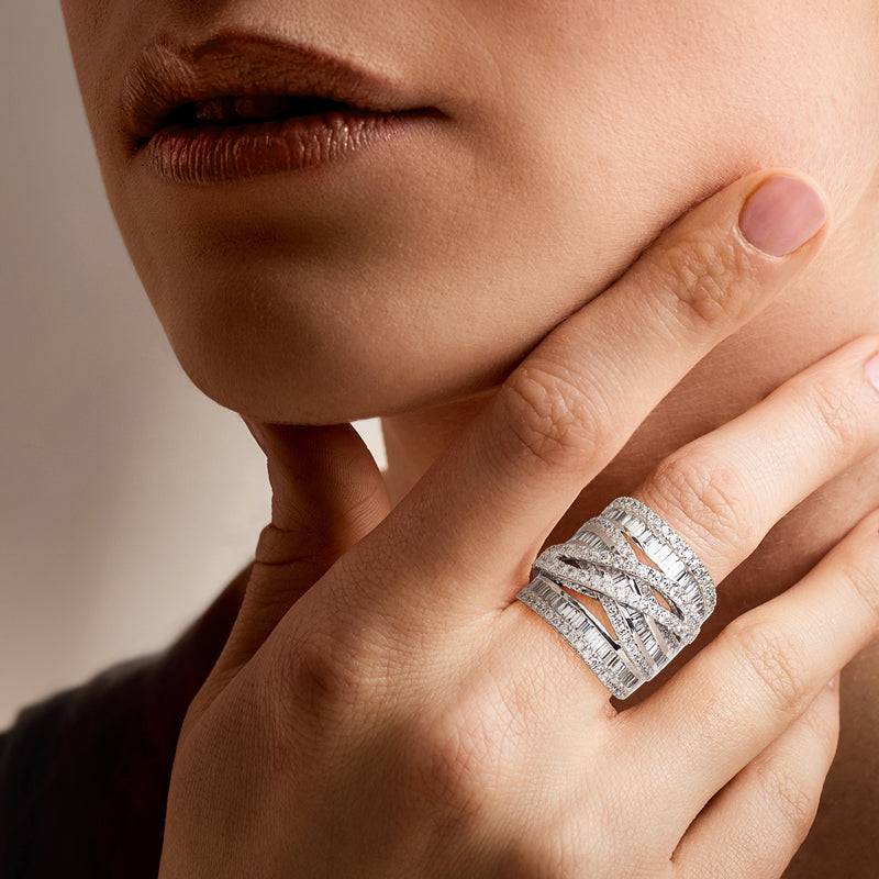 Diamond highway ring in 14kt white gold, worn on finger with baguette and round stones