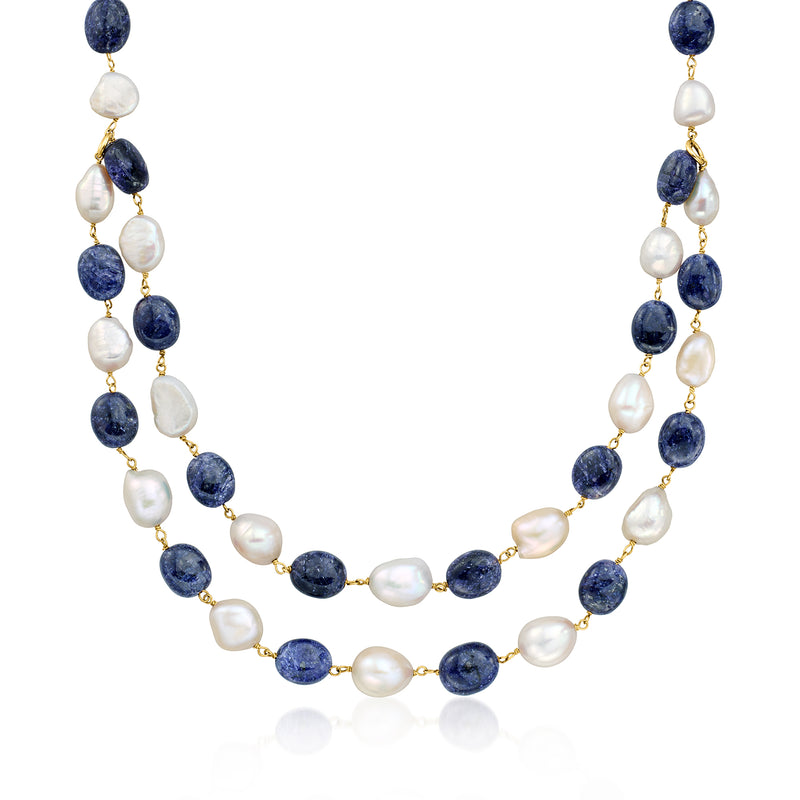 Two-strand bead necklace with baroque white pearls, dark blue sapphire beads, gold-tone links