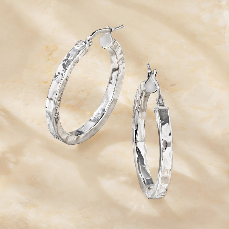 Sterling silver hammered hoop earrings, one side view with clasp back