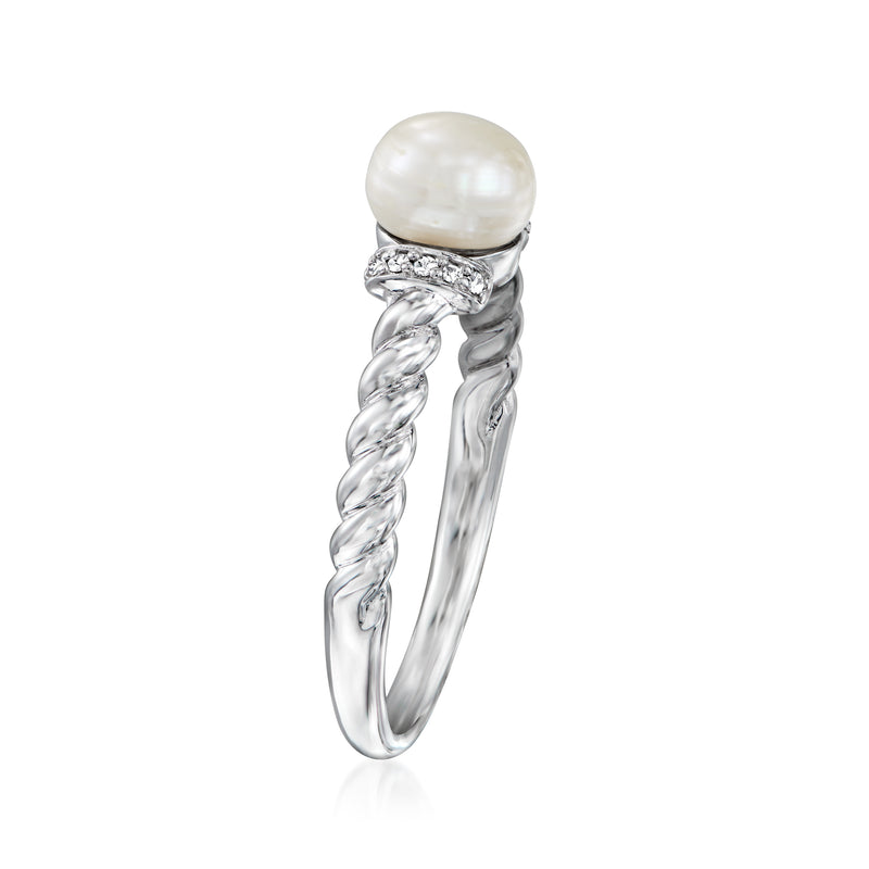 Sterling silver pearl ring with twisted band and diamond-like detail on top