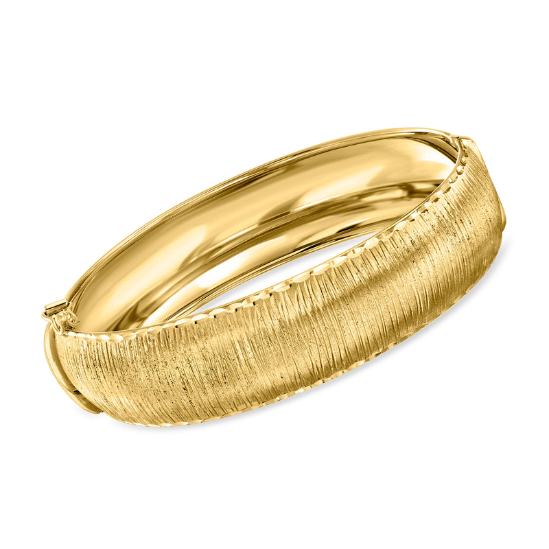 14kt yellow gold bangle bracelet with textured side and polished inner surface