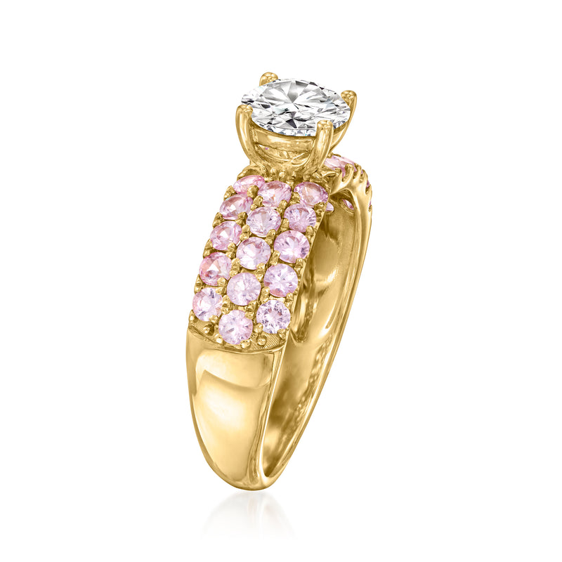 Side view of 14kt yellow gold ring with pink sapphire band and round diamond