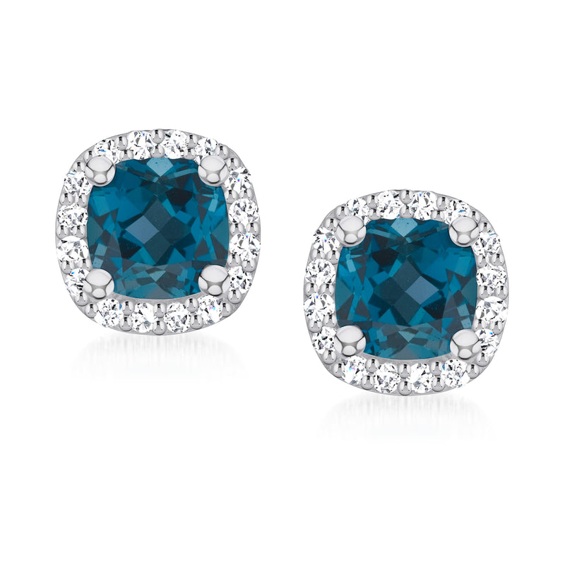 London blue topaz stud earrings with diamond halo settings in 14kt white gold