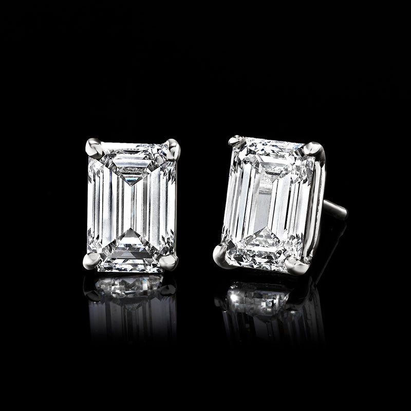 Emerald-cut lab-grown diamond stud earrings in white gold, prong-set close-up