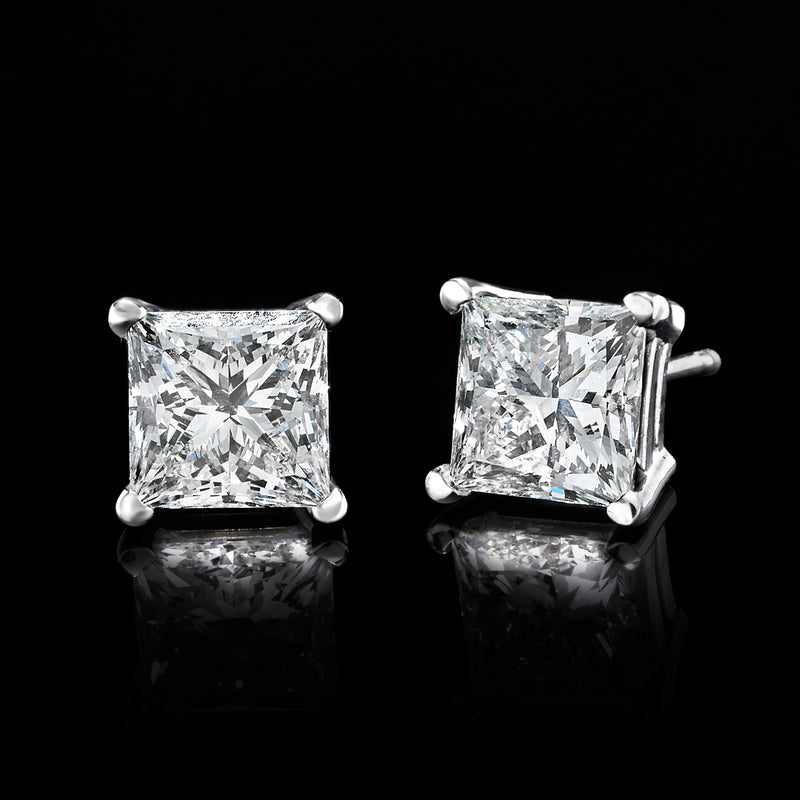 White gold princess-cut diamond stud earrings with square stones and secure prong bezels.