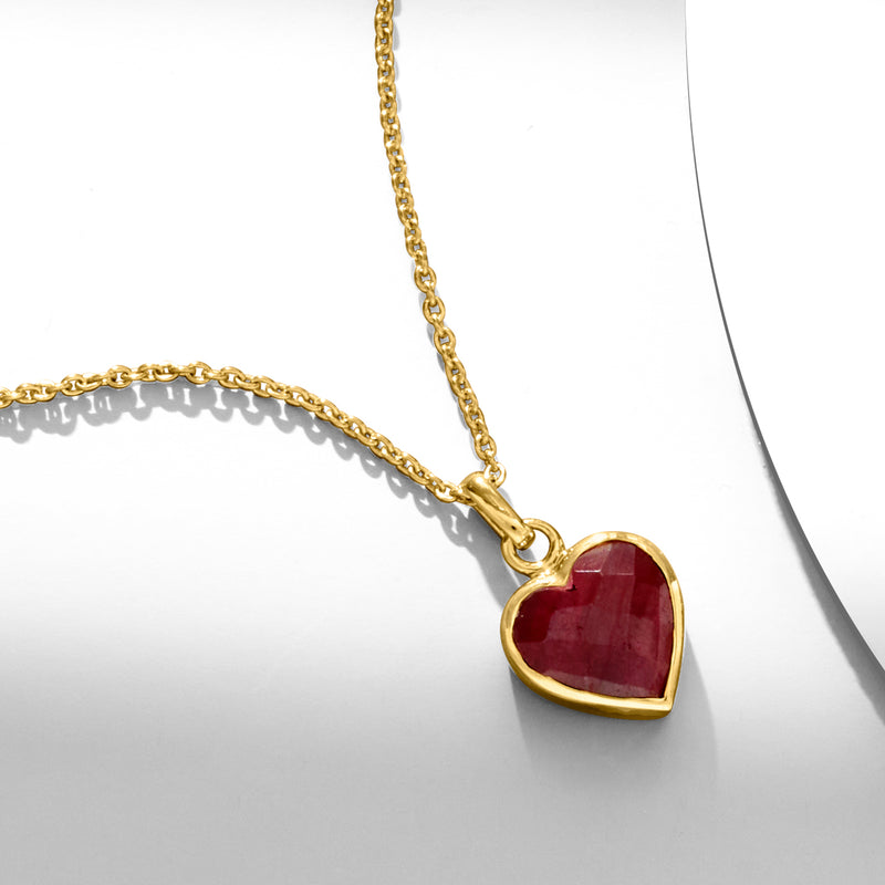 Ruby heart pendant necklace on gold chain with red stone in gold bezel