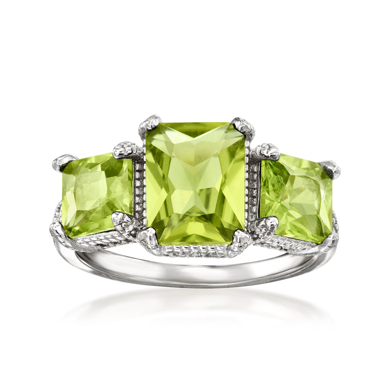 Sterling silver ring with green peridot center and clear zircon accents