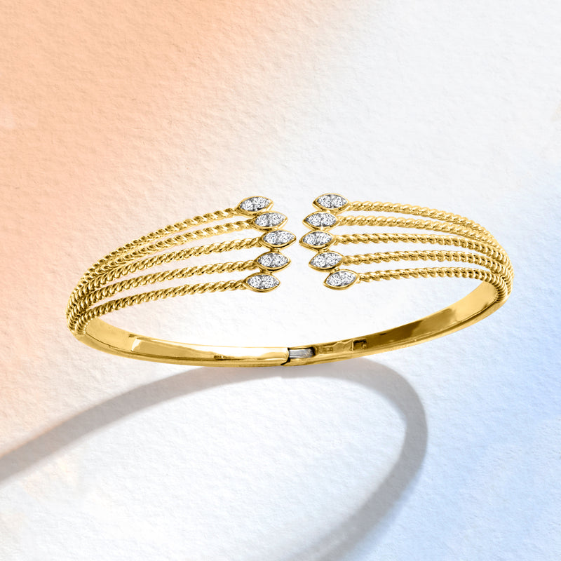 Gold diamond multi-row cuff bracelet with oval stone accents and hinged closure