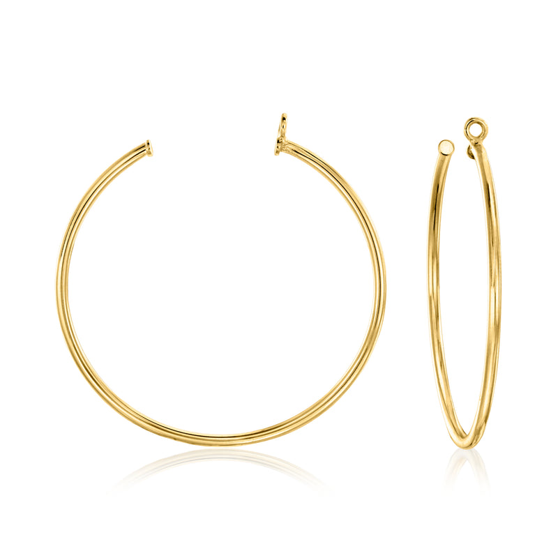 Gold hoop earrings with clear round CZ accents, hinged backs visible