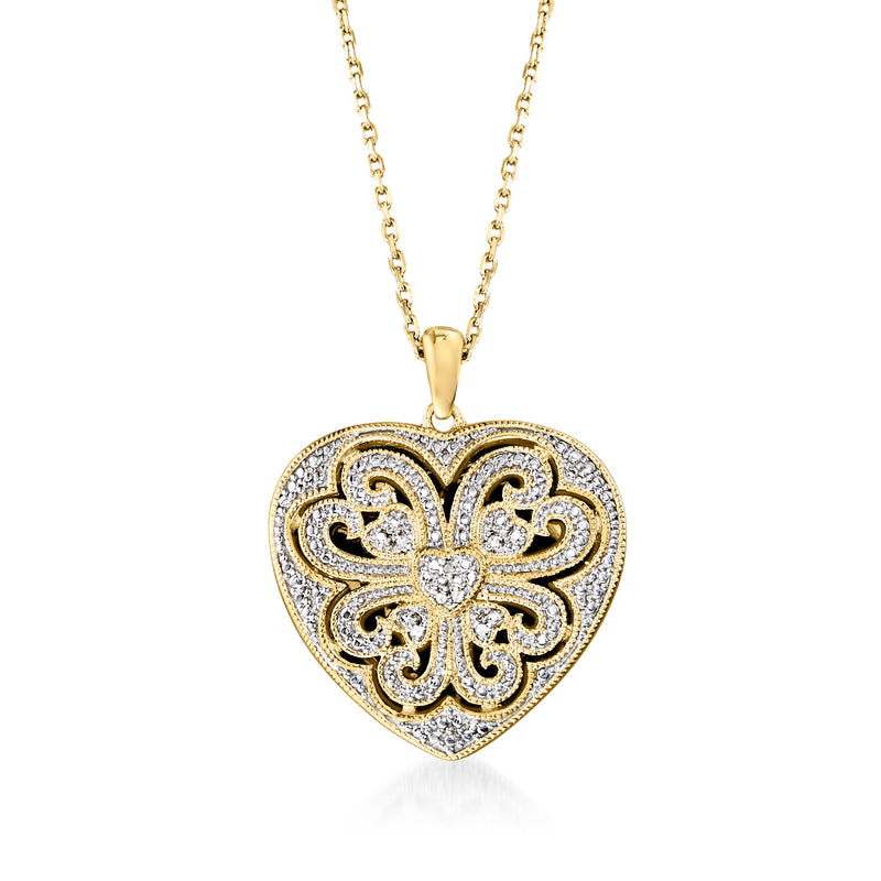Gold heart locket necklace with scrolled filigree, diamond accents, and chain