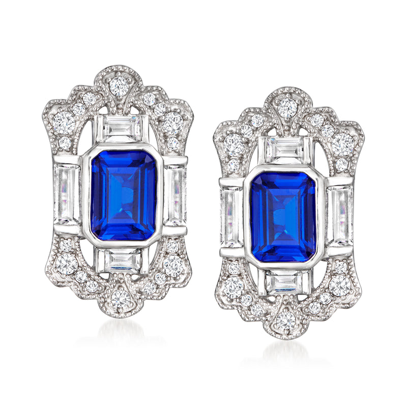 Sterling silver stud earrings with blue simulated sapphire center and CZ halo, post style