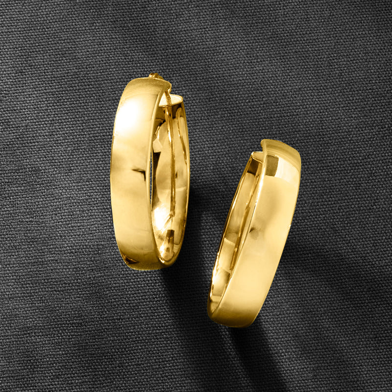 Pair of yellow gold hoop earrings, shiny round hoops with hinge