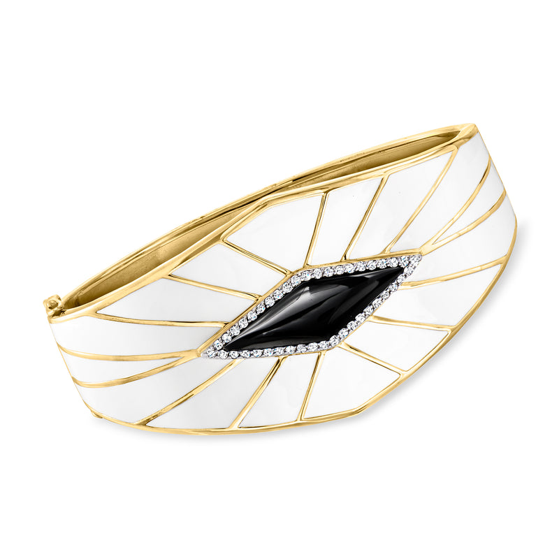 Gold bangle bracelet with black oval onyx centerpiece, white enamel web and small clear stones.
