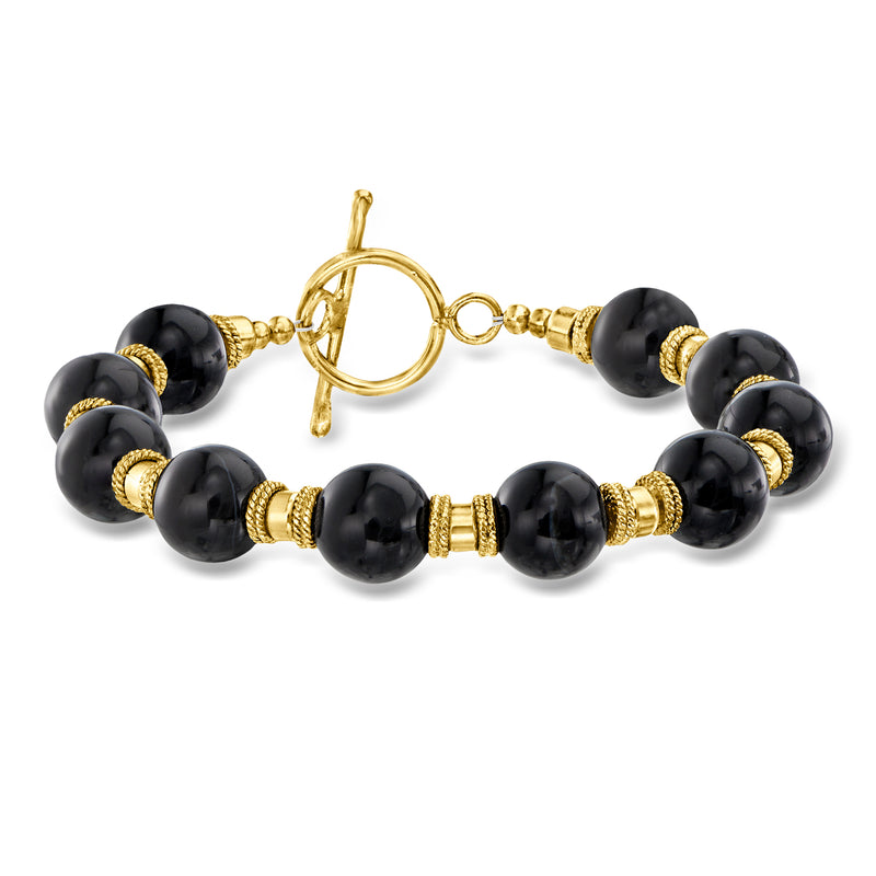 Onyx bead bracelet with gold-tone spacers and toggle clasp, dark round beads