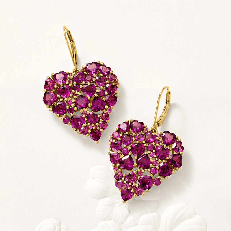 Heart-shaped purple gemstone drop earrings with gold leverback, viewed from an angle
