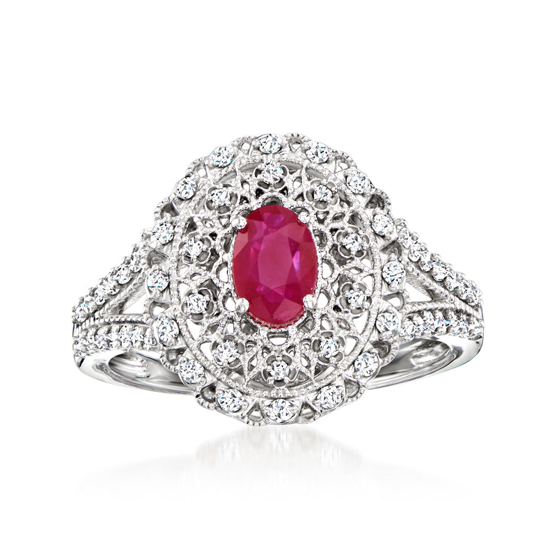 Sterling silver ruby and diamond milgrain ring with oval red center and halo