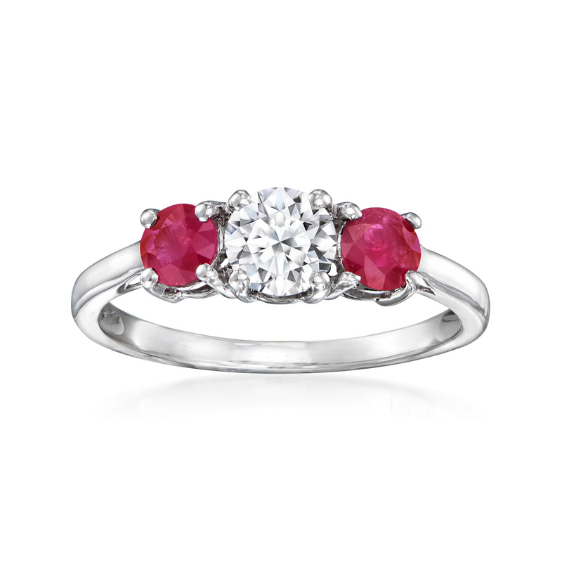 14kt white gold ring with center round diamond and two red ruby side stones