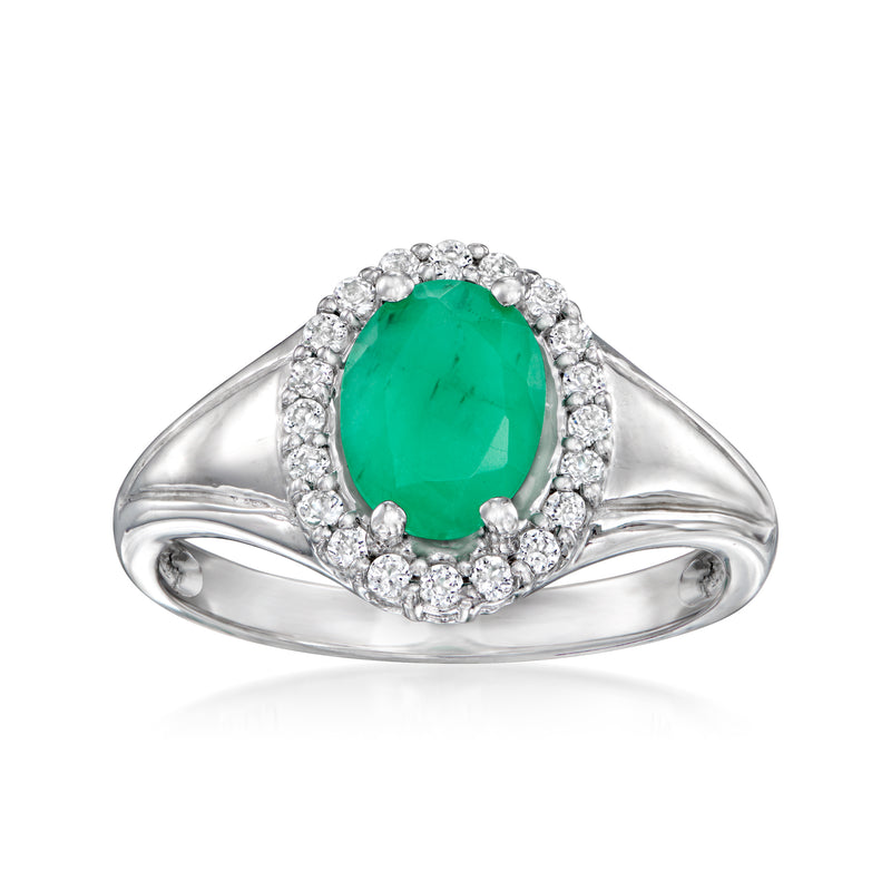 Sterling silver ring with oval green gemstone and halo of clear white stones
