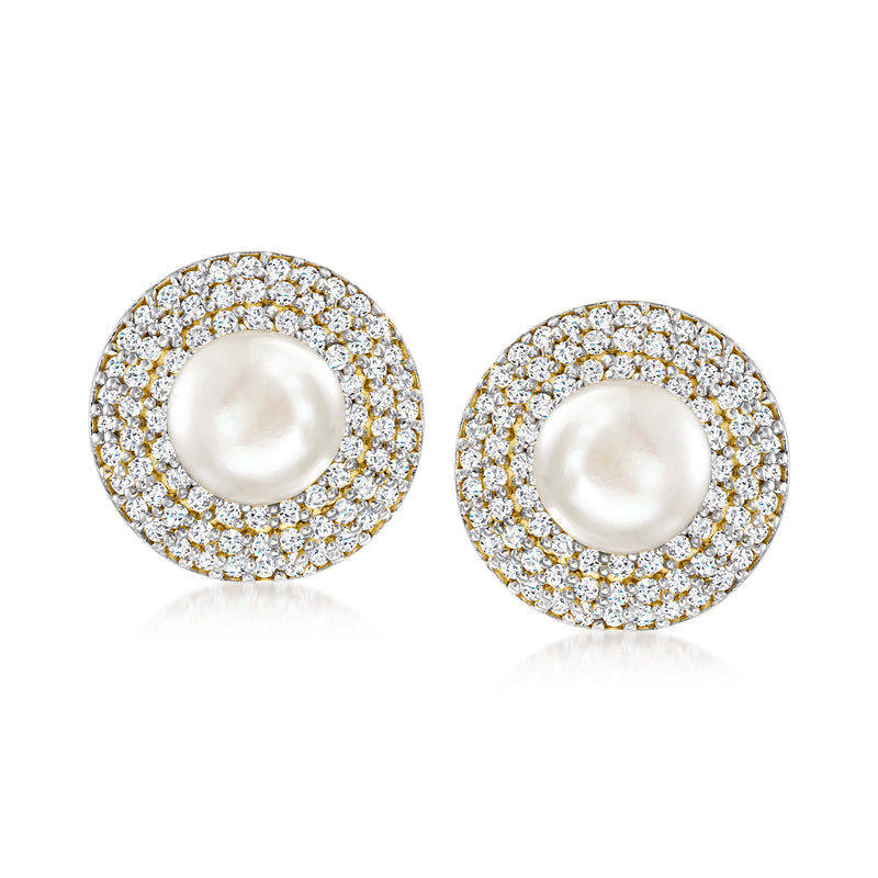 Gold-tone stud earrings with round white pearl and halo of clear stones