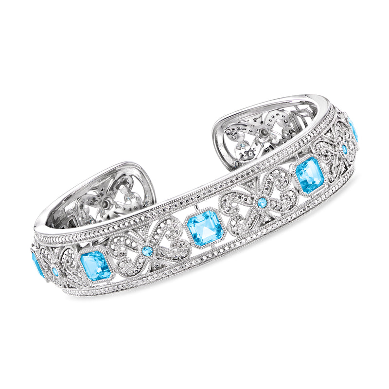 Sterling silver cuff bracelet with milgrain detail and three square Swiss blue topaz gemstones