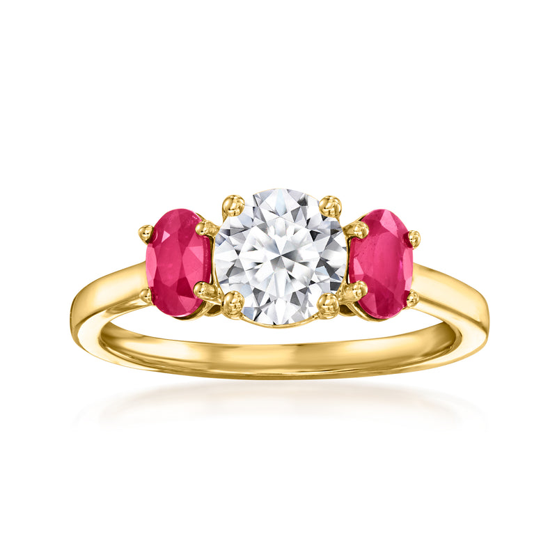 14kt yellow gold ring with round diamond center and two oval pink ruby side stones