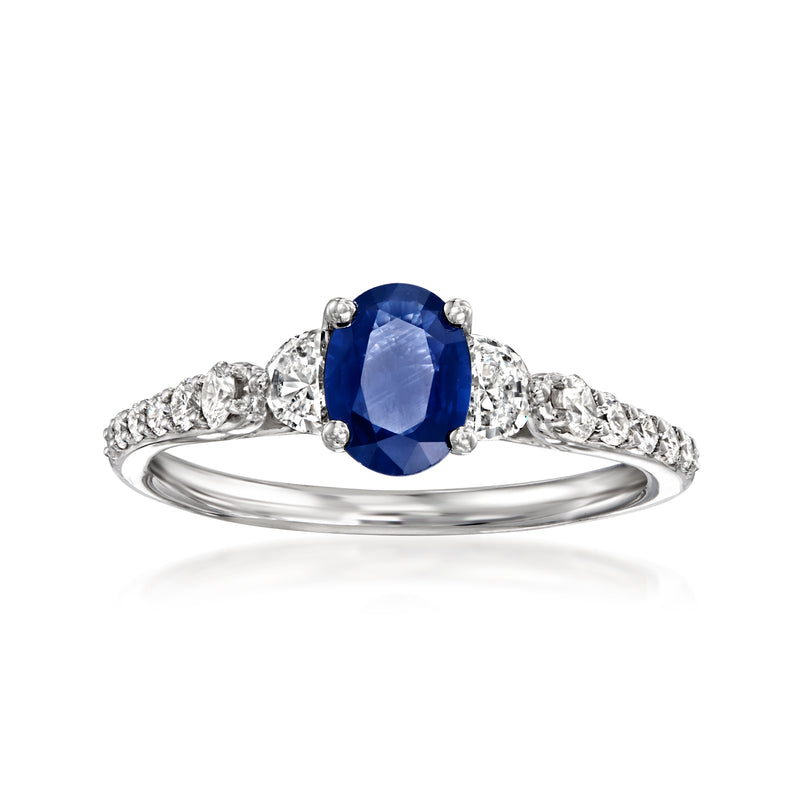 14kt white gold sapphire ring with oval blue center stone and diamond side accents