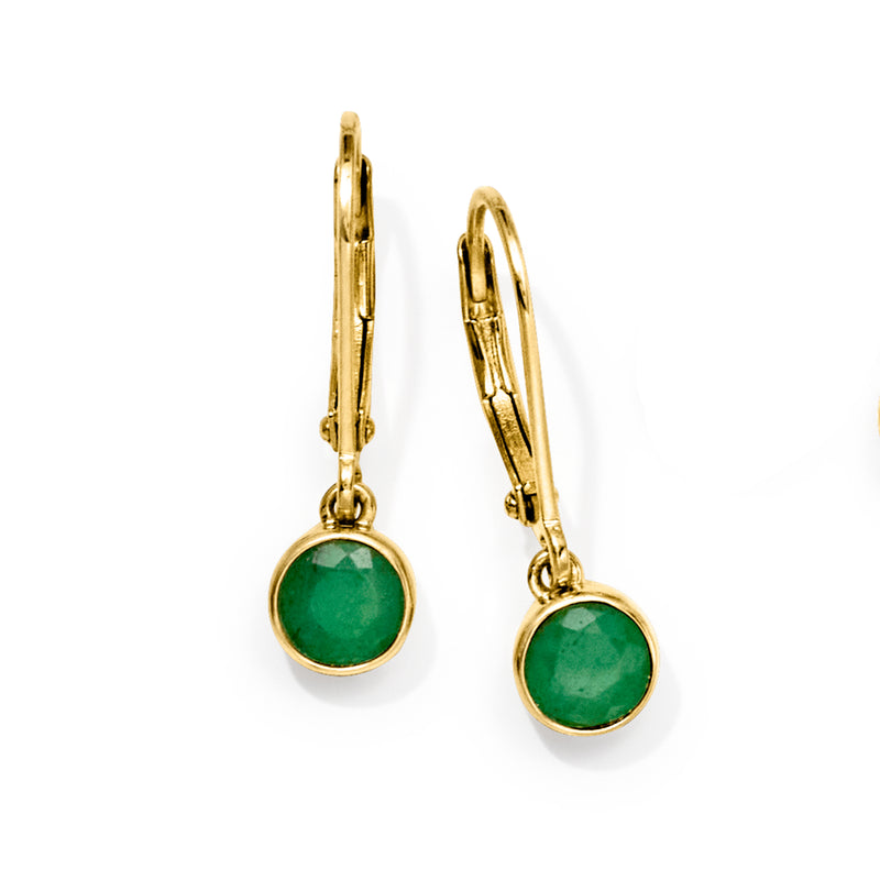 Gold leverback drop earrings with green bezel-set emerald gemstones, side view