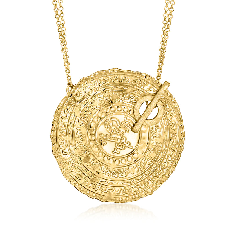 Gold-tone coin toggle necklace with textured Arabic-inspired round pendant and chain
